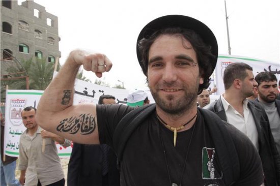 Vittorio's tattoo on his arm moqawama resistance 